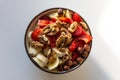 Helthy vegan bowl of nuts and fruit for brekfast