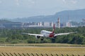 Helvetic Airways Embraer E-190-E2 jet landing on runway 14 in Zurich in Switzerland Royalty Free Stock Photo