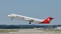 Helvetic Airways flying up in the blue sky Royalty Free Stock Photo