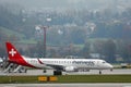 Helvetic Airways plane taxiing in Zurich Airport, ZRH