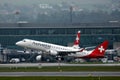 Helvetic Airways plane taking off from Zurich Airport, ZRH Royalty Free Stock Photo