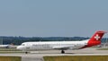 Helvetic Airways plane taxiing in Munich Airport Royalty Free Stock Photo