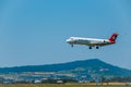 Helvetic Swiss airlines airplane preparing for landing at day time in international airport Royalty Free Stock Photo