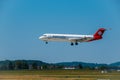 Helvetic Swiss airlines airplane preparing for landing at day time in international airport Royalty Free Stock Photo