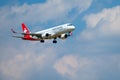 Helvetic Swiss airlines airplane preparing for landing at day time in international airport Royalty Free Stock Photo