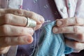 Hemming a dress, woman hands needlework