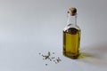 Hemp oil in a glass bottle and seeds on a white wooden background. Horizontal photo Royalty Free Stock Photo