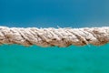 Hemp rope old close-up on the background of the sea, selective focus Royalty Free Stock Photo