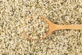 Hemp seeds background with wooden spoon Royalty Free Stock Photo