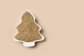 Hemp seeds in plate shape of Christmas tree. Xmas vertical eco greeting card.