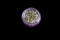 hemp seeds in a purple glass jar Royalty Free Stock Photo