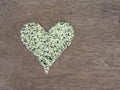 Hemp seeds shaped in heart symbol