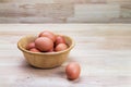 Hen's eggs in wooden bowl