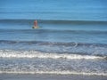 Hendaye, New Aquitaine/France; 08 17 2014: Man returning to the beach doing paddle surf
