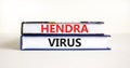 Hendra virus symbol. Concept words Hendra virus on books. Beautiful white table white background. Medical hendra virus concept. Royalty Free Stock Photo