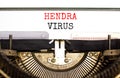 Hendra virus symbol. Concept words Hendra virus typed on white paper on old retro typewriter. Beautiful white background. Medical Royalty Free Stock Photo