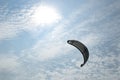 Henichesk, Ukraine - July 12, 2021: Kitesurfing athlete on kite with board. Foiling kiteboarding kitesurfing kiteboarder in ocean