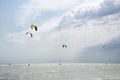 Henichesk, Ukraine - July 12, 2021: Kitesurfing. Practicing kitesurfing at summer beach. Active travel sport recreation.