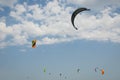 Henichesk, Ukraine - July 12, 2021: Kitesurfing. Practicing kitesurfing at summer beach. Kitesurfer doing tricks. People enjoy