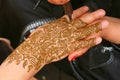 Henna being applied to woman's hand Royalty Free Stock Photo