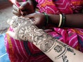 Henna mehendi on hand Indian tattoo making Royalty Free Stock Photo