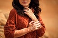 Henna Mehndi. Mehendi on hands. Outdoor portrait of attractive woman in sweater with curly hair