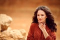 Henna Mehndi. Mehendi on hands. Outdoor portrait of attractive woman in sweater with curly hair