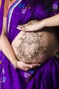 Henna tatoo on pregnant belly