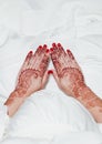 Henna tattoo on hands holding on white dress Royalty Free Stock Photo