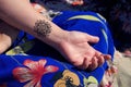 Henna tattoo mehendy on hand mandala Royalty Free Stock Photo