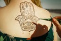 Henna tattoo mehendy painted on back