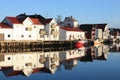 Hennigsvaer's dock's houses mirroring Royalty Free Stock Photo