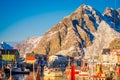 Henningsvaer, Norway - April 04, 2018: Picturesque fishing port in Henningsvaer with typical red wooden buildings and