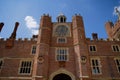 Henry VIII`s Astronomical Clock at Hampton Court Palace Clock Court. Viewed against blue sky.