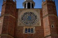 Henry VIII`s Astronomical Clock at Hampton Court Palace Clock Court. Viewed against blue sky.