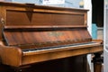Aldershot, UK - 5th September 2020: Henry Ward wooden grand piano, vintage old on display in museum in Aldershot, UK Royalty Free Stock Photo