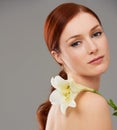 Her beaty is as delicate as a flower. Beauty shot of a young woman with cosmetics against a white background. Royalty Free Stock Photo