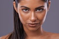 Her beauty gives her confidence. Portrait of a beautiful young woman posing in the studio.