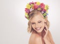 Her beauty is true. A young woman posing with her eyes shut and flowers in her hair. Royalty Free Stock Photo