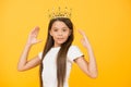 Her design is perfect. confident child in queen crown. rich royal accessory. dream about future wealth. happy childhood