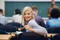 Her education is important to her. Portrait of a university student in a lecture hall.