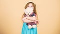Her favorite toy. Little girl holding soft toy. Small child cuddling teddy bear toy. Adorable girl child with cute Royalty Free Stock Photo