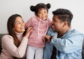 Her giggle is my favourite sound. Shot of parent playfully tickling their daughter.