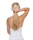 Her hair is her crowning glory. Rearview studio shot of a young blonde woman with long blonde hair isolated on white.