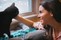 Her heart belongs to her kitty. an attractive young woman relaxing on the sofa at home and bonding with her cat. Royalty Free Stock Photo