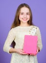 Her hobby is reading. Cute small child holding book for home reading. Adorable little girl enjoy reading books Royalty Free Stock Photo