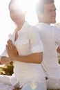 Her minds always on him. a young man and woman doing yoga outdoors. Royalty Free Stock Photo