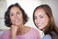 Her mom will always be her best friend. A mother and daughter smiling happily while they spend time indoors. Royalty Free Stock Photo
