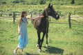 Her most loyal friend. Pretty girl at horse ranch. Adorable horse owner with her pet. Making friends with horse