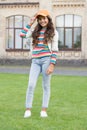 In her own style. childhood happiness. happy girl with long curly hair. pretty child smiling outdoor. kid beauty and Royalty Free Stock Photo